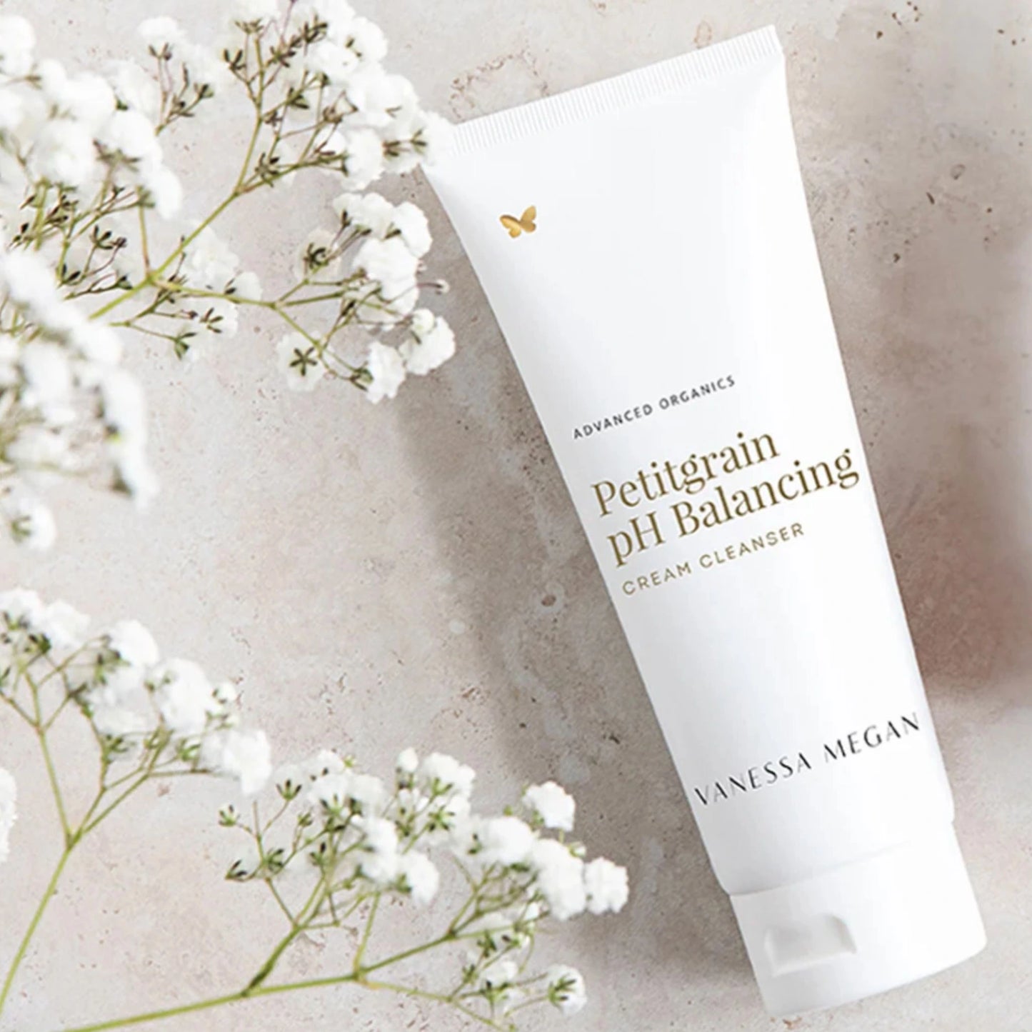 Vanessa Megan Petitgrain pH Balancing Cream Cleanser flatlay with baby's breath – gentle organic face wash for sensitive skin