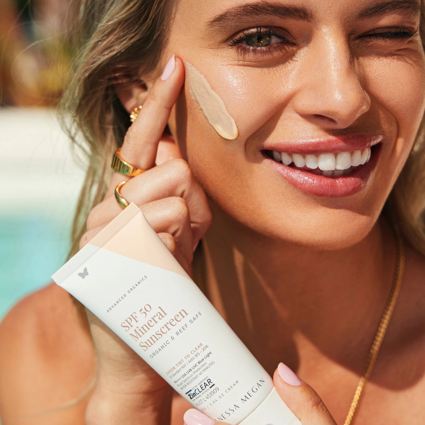 Woman applying Vanessa Megan SPF 50 Mineral Sunscreen to Her Face