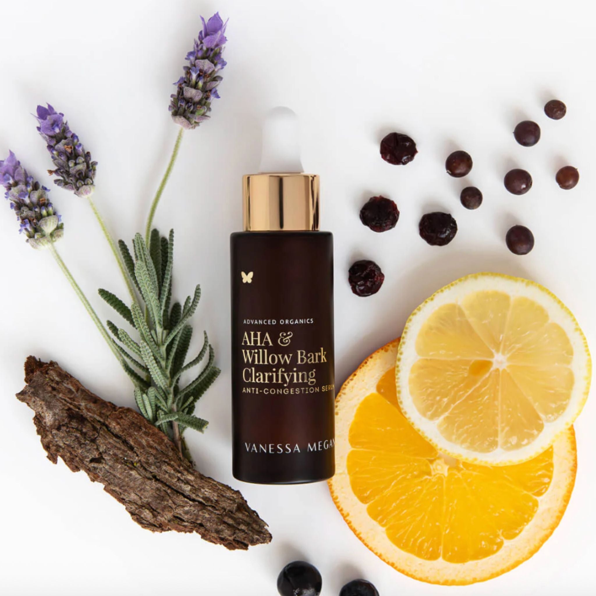 Vanessa Megan AHA and Willow Bark Clarifying Serum with citrus slices lavender berries and willow bark ingredients.
