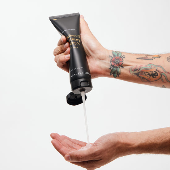 Vanessa Megan Bamboo and Rosemary Clarifying Shampoo – lightweight natural formula pouring from sugarcane tube into hand