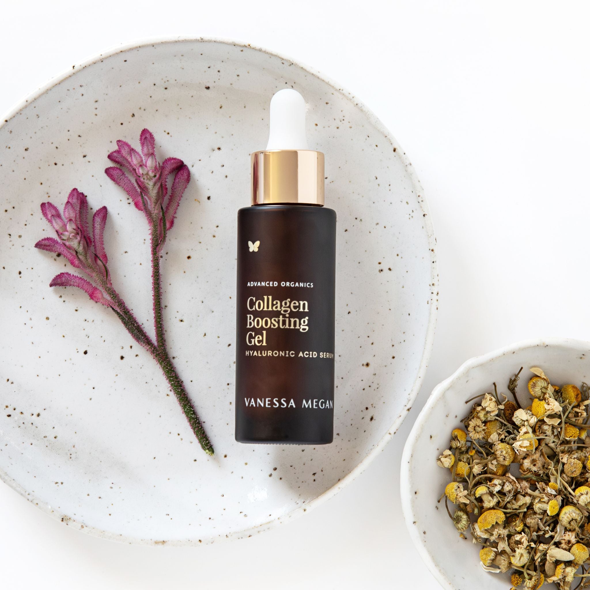 Vanessa Megan Collagen Boosting Gel Hyaluronic Acid Serum with natural botanicals on ceramic plate.