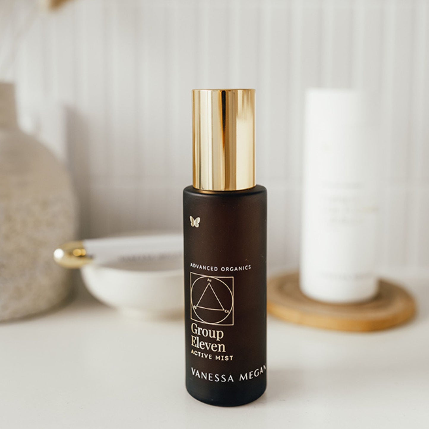 Vanessa Megan Group Eleven Active Mist natural hydrating facial mist on bathroom vanity.
