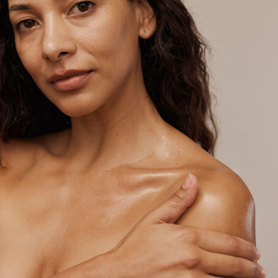 Vanessa Megan Intensive Dermal Repair Moisture Balm applied to face and décolletage, model massaging rich natural balm into skin, deep hydration for dry sensitive and mature skin.