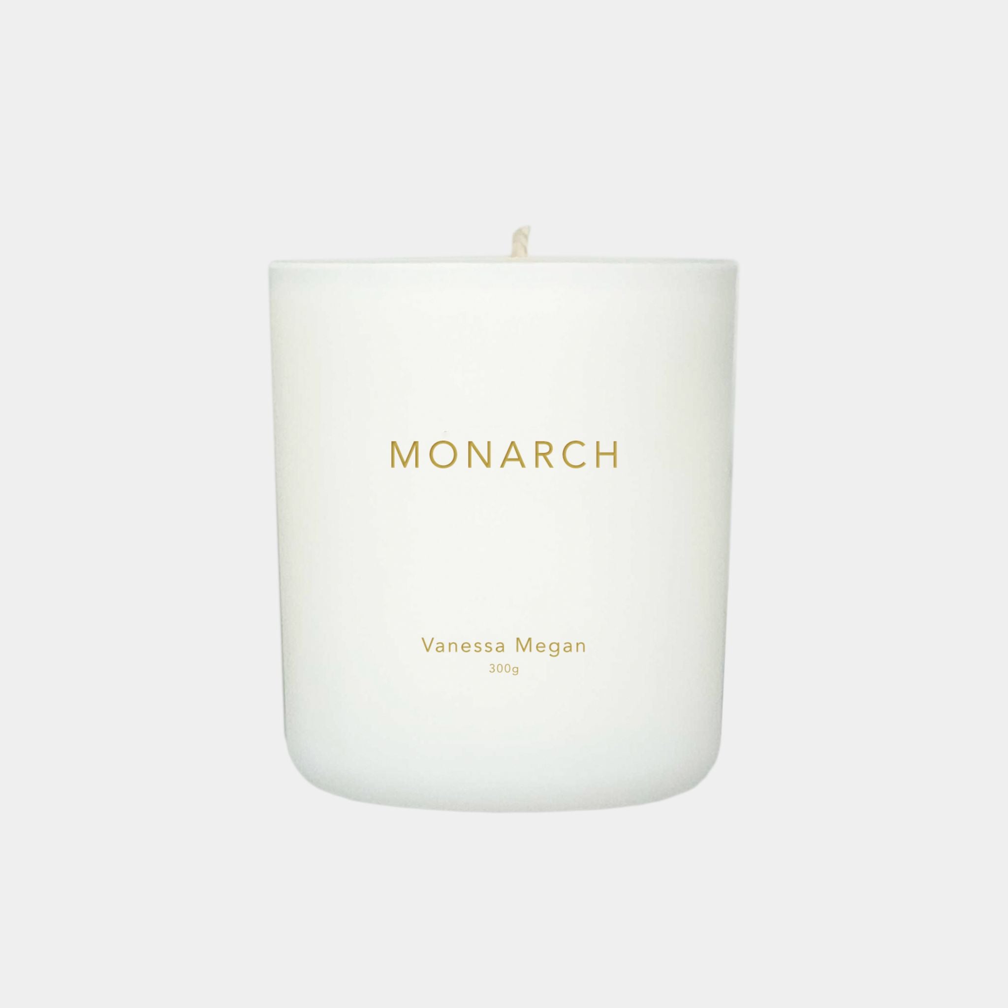 Vanessa Megan Monarch 100% Natural Soy Wax Candle in white glass jar with cotton wick.