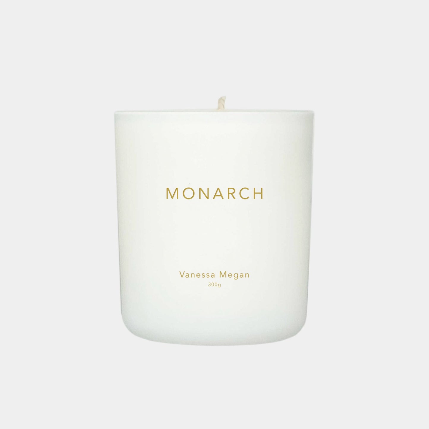 Vanessa Megan Monarch 100% Natural Soy Wax Candle in white glass jar with cotton wick.