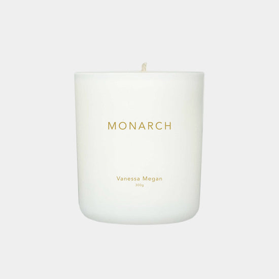 Vanessa Megan Monarch 100% Natural Soy Wax Candle in white glass jar with cotton wick.