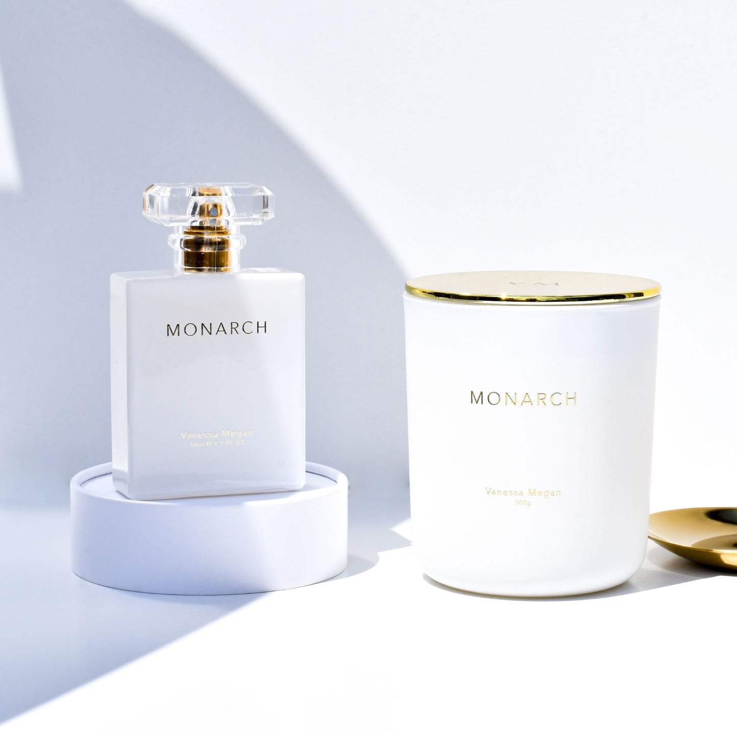 Side-by-side of the Vanessa Megan Monarch 100% Natural Perfume and Soy Wax Candle, both crafted with the same award-winning essential oil scent blend that evokes emotional balance, grounding and sensory calm.