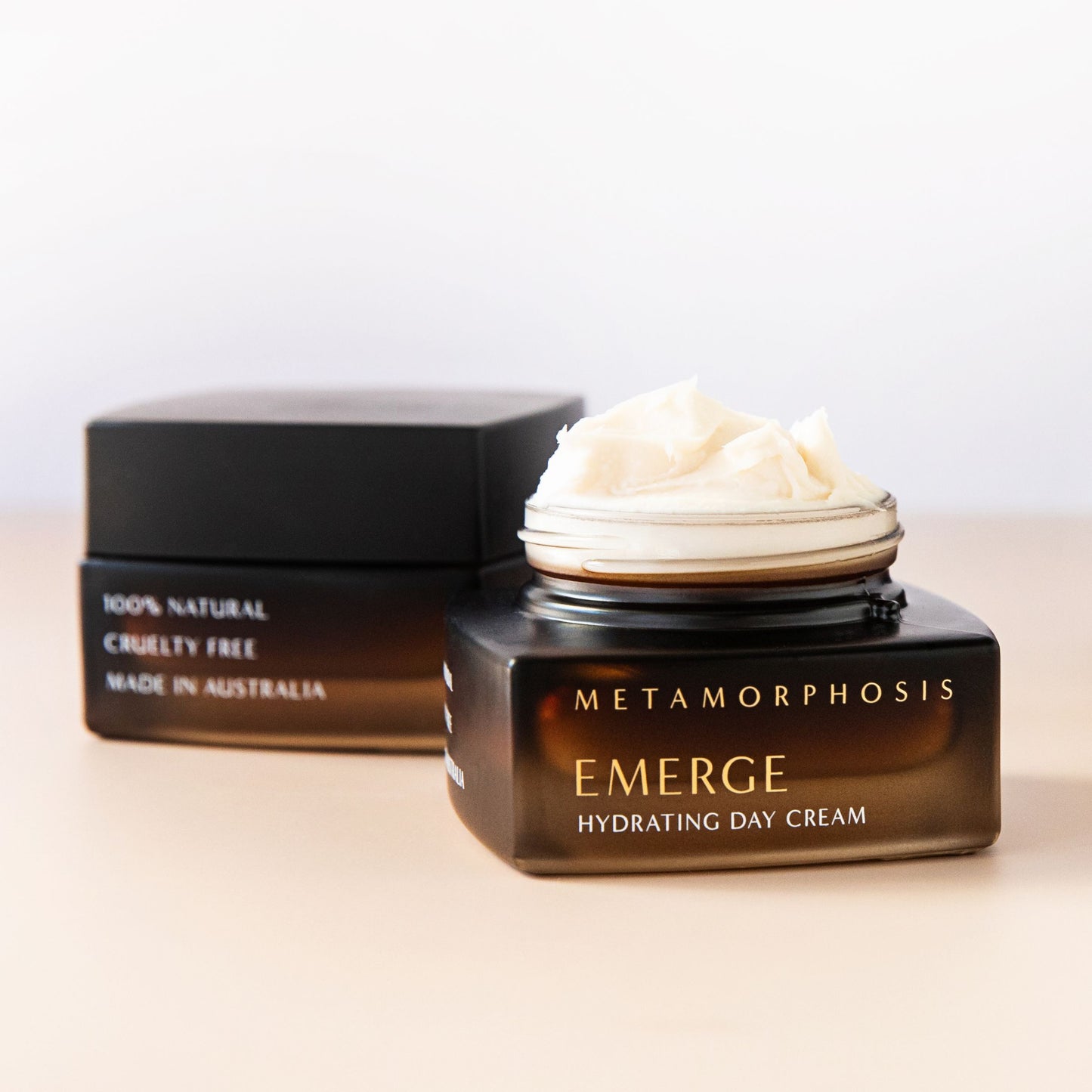 Metamorphosis Emerge Hydrating Day Cream – open jar showing rich, natural cream texture. 100% natural, cruelty free, made in Australia. Daily hydration for peri to post-menopausal skin, available at Intentionally Natural NZ.