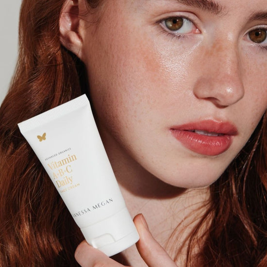 Women holding Vanessa Megan Vitamin A+B+C Daily Face Cream with radiant and hydrated skin with a natural healthy glow.