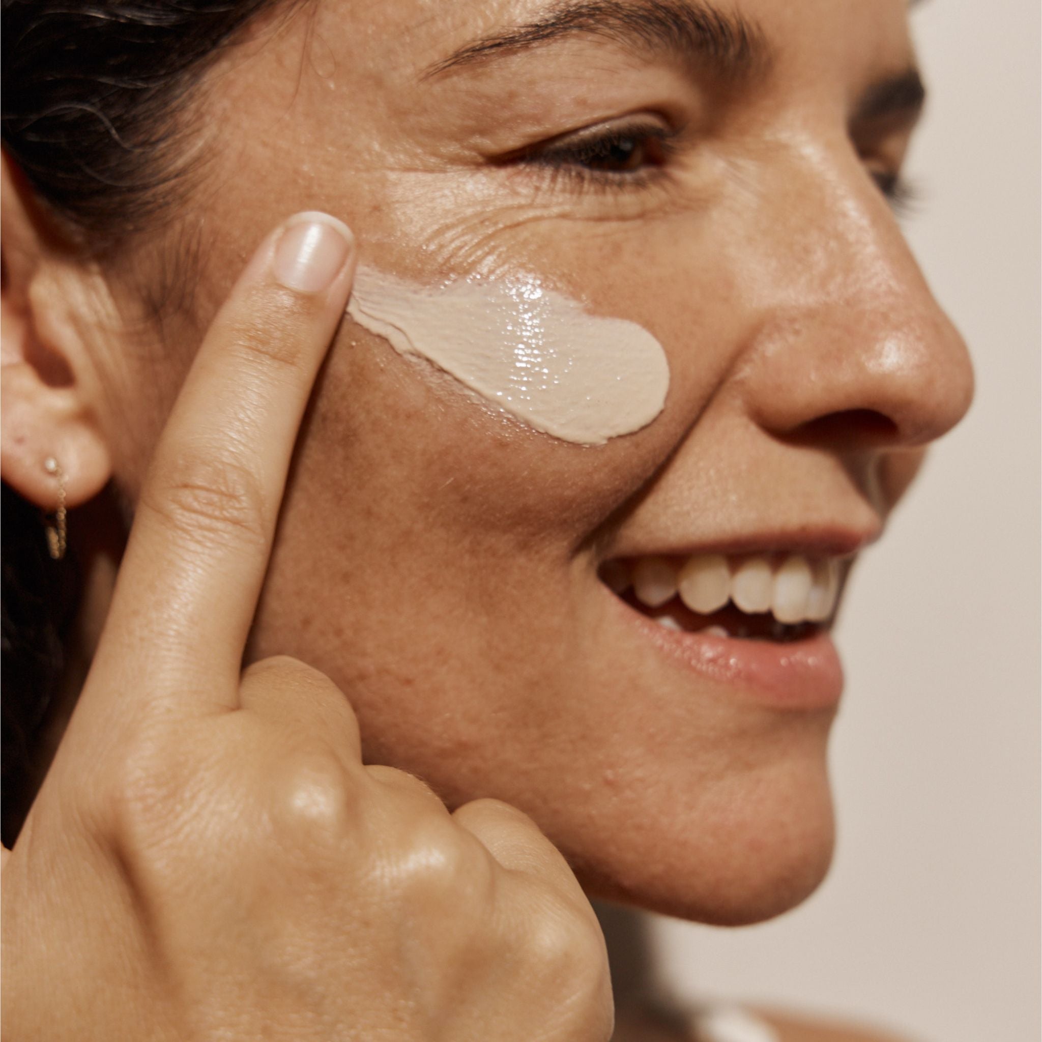 Vanessa Megan SPF 50 Mineral Sunscreen close up application on cheek, natural zinc based sunscreen with broad spectrum protection.